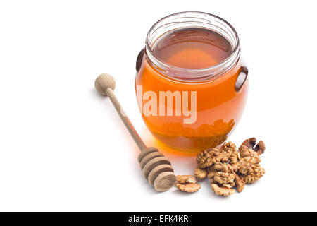 Il miele in un vaso e noci Foto Stock