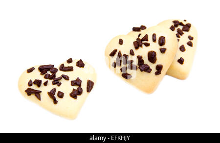 A forma di cuore i biscotti con il cioccolato su sfondo bianco Foto Stock