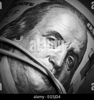 Rotolo di fatture del dollaro di close-up - denaro mantenere silenzioso concetto Foto Stock