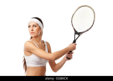 Donna adulta giocando a tennis. Foto Stock