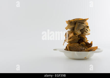 La procrastinazione - stack di usato bustine di tè in tè macchiato porta sacchetti Foto Stock