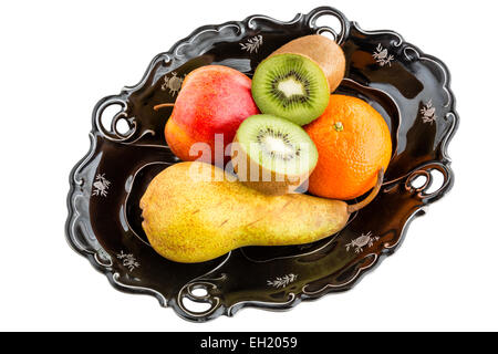 Frutti nella ciotola vintage - pera, mela, kiwi, mandarino Foto Stock