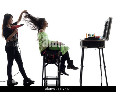 Donna e parrucchiere in silhouette su sfondo bianco Foto Stock
