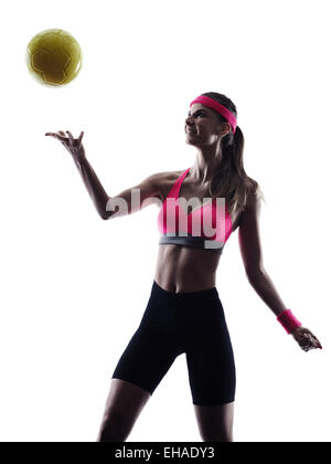 Una donna beach volley player in silhouette silhouette studio isolato su sfondo bianco Foto Stock
