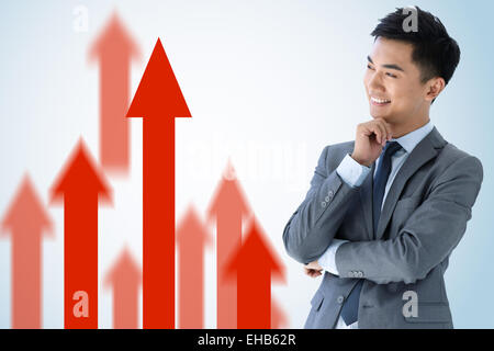 Oriental giovani uomini d' affari e freccia rossa Foto Stock