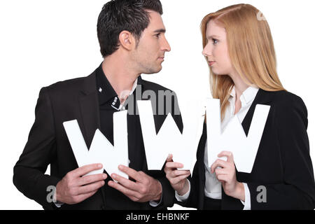 L uomo e la donna in abiti Foto Stock