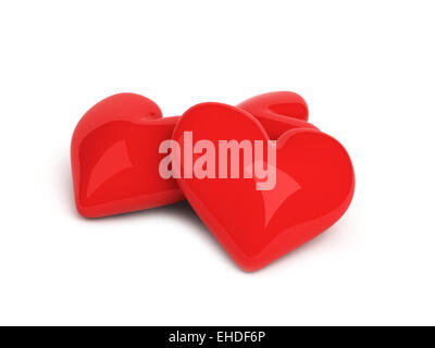 Tre cuori rossi su sfondo bianco Foto Stock