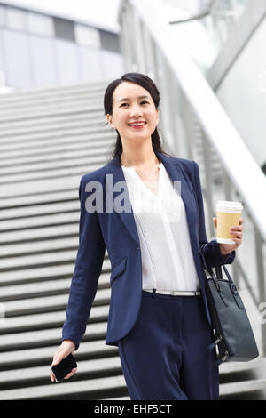 Business orientali le donne lavorano in anticipo Foto Stock