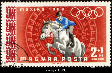 Ungheria - circa 1968: un timbro postale stampato in Ungheria mostra jockey di equitazione Foto Stock