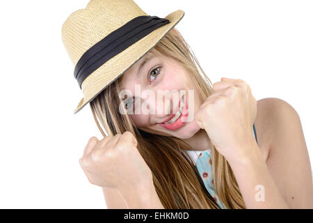 Sorridente adolescente che mostra i pugni su sfondo bianco Foto Stock