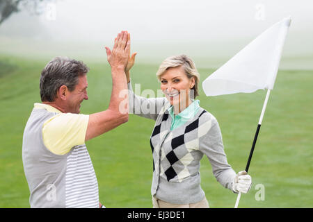 Golf giovane alta fiving Foto Stock