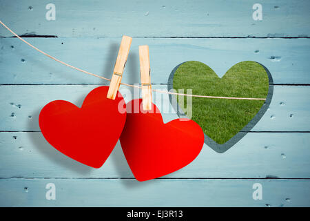 Immagine composita di cuori hanging on line Foto Stock