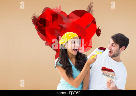 Immagine composita di felice coppia giovane pittura insieme e ridere Foto Stock
