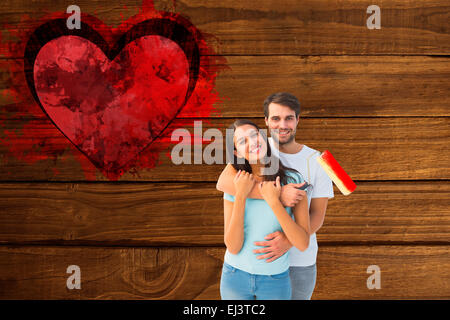 Immagine composita di felice coppia giovane pittura insieme Foto Stock
