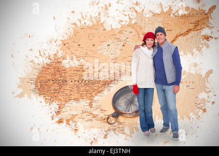 Immagine composita della coppia felice in un abbigliamento caldo Foto Stock