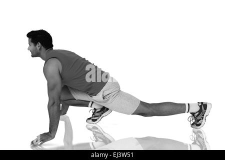 Immagine composita della vista laterale di un montare l'uomo facendo esercizio di stretching Foto Stock