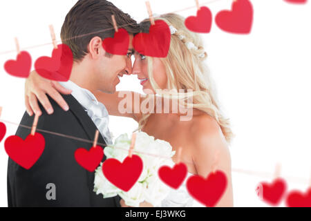 Immagine composita della giovane e bella coppia sposata alla ricerca di ogni altro nel volto Foto Stock