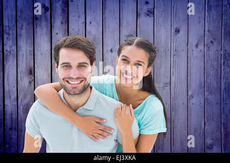 Immagine composita di carino coppia sorridente in telecamera Foto Stock