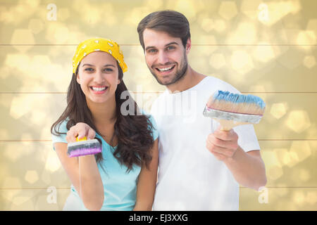 Immagine composita di felice coppia giovane pittura insieme Foto Stock