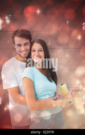 Immagine composita di felice coppia giovane pittura insieme Foto Stock