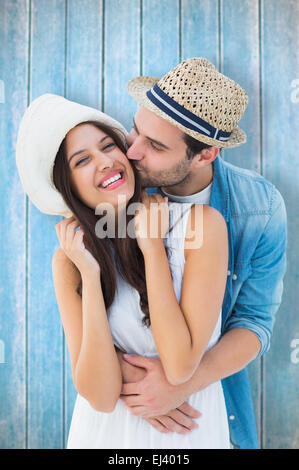 Immagine composita di felice hipster giovane costeggiata e sorridente Foto Stock