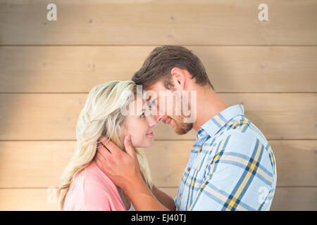 Immagine composita della coppia attraente sorridente ad ogni altro Foto Stock