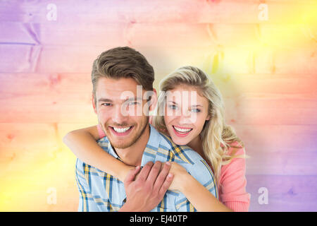 Immagine composita della coppia attraente abbracciando e sorridente in telecamera Foto Stock