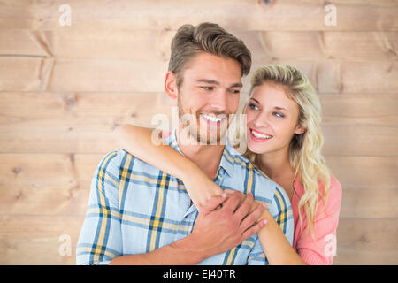 Immagine composita della coppia attraente abbracciando e sorridente Foto Stock