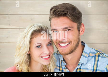 Immagine composita di attraente giovane coppia sorridente in telecamera Foto Stock