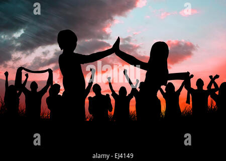 Immagine composita di sagome dei tifosi di calcio Foto Stock