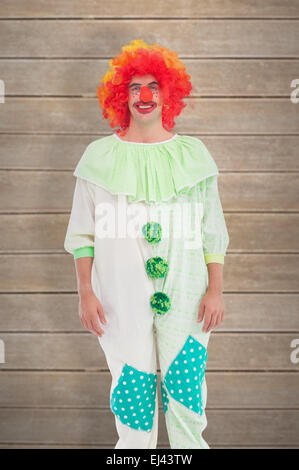 Immagine composita di divertenti clown sorridente in telecamera Foto Stock