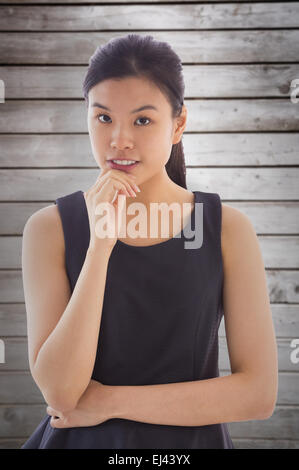 Immagine composita di pensosa asian imprenditrice Foto Stock