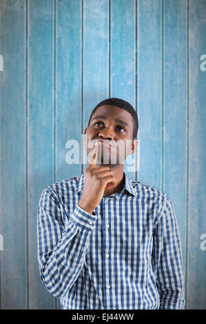 Immagine composita del giovane imprenditore pensando Foto Stock