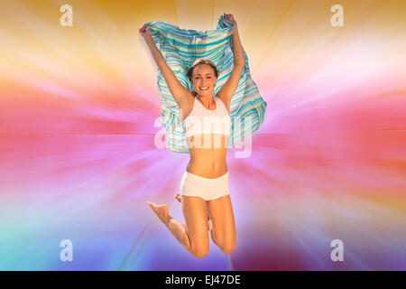 Immagine composita della splendida montare blonde jumping con sciarpa Foto Stock