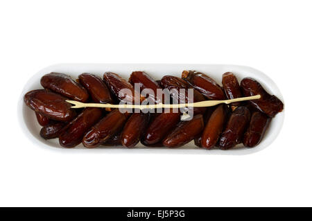 Datteri freschi sul vassoio di plastica Foto Stock
