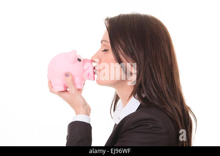 Donna felice kissing piggy Foto Stock