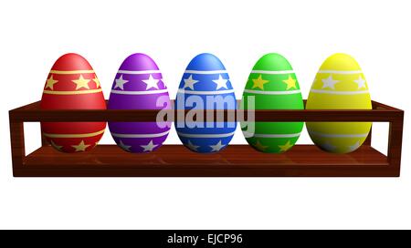 Colorate le uova di Pasqua in un rack in legno Foto Stock