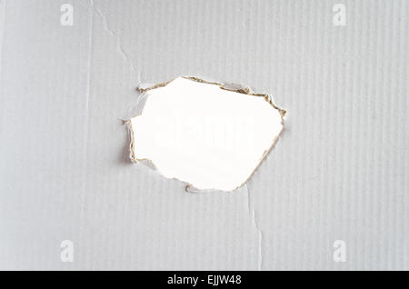 Un foro nella carta e posto per testo concettuale Foto Stock