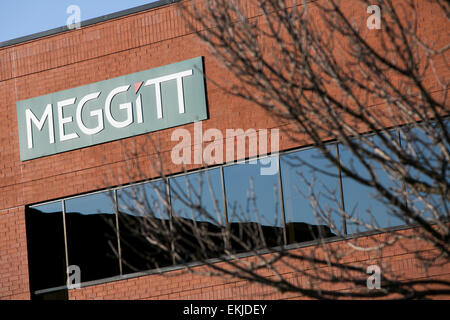 Un segno del logo al di fuori al di fuori di un edificio occupato da Meggitt. Foto Stock