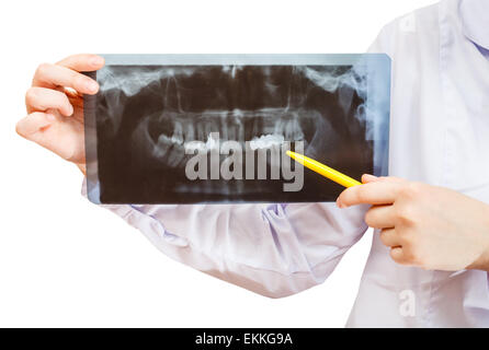 L'infermiera contiene X-ray foto con ganascia umano isolato su sfondo bianco Foto Stock