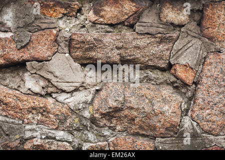 Parete. Naturale di pietra di granito la texture dello sfondo. Ruvido e arrugginito. Close-up, macro Foto Stock