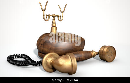 Un vintage in legno e ottone con telefono dial abbellimenti e il ricevitore giacente fuori il gancio su un isolato bianco backg studio Foto Stock