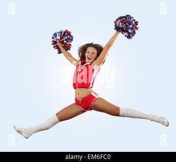 Cheerleader ragazza jumping Foto Stock