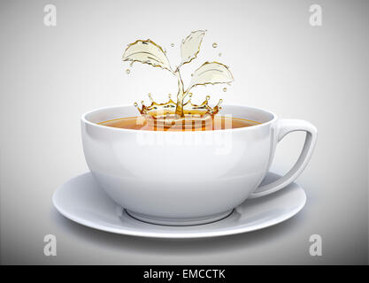 Splash del tè in forma di un impianto nella tazza bianca Foto Stock
