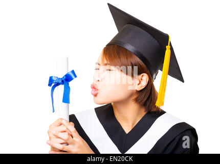 Felice giovane donna laurea kissing diploma Foto Stock