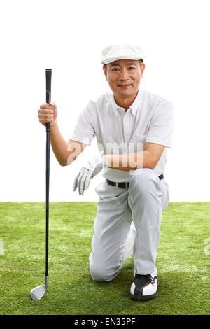 L'uomo di mezza età giocando a golf Foto Stock