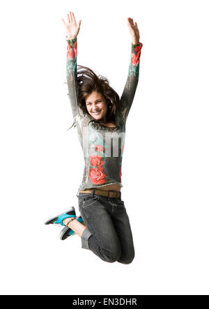 Ritratto in studio della ragazza adolescente (16-17) jumping, sorridente Foto Stock