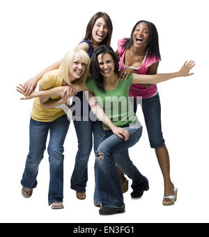Quattro donne ridere e giocare Foto Stock