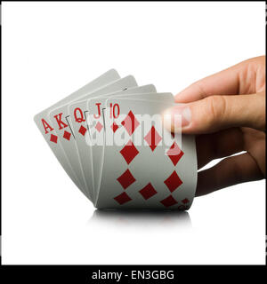 Mano che tiene le carte da gioco Foto Stock