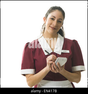 Cameriera prendendo un ordine Foto Stock